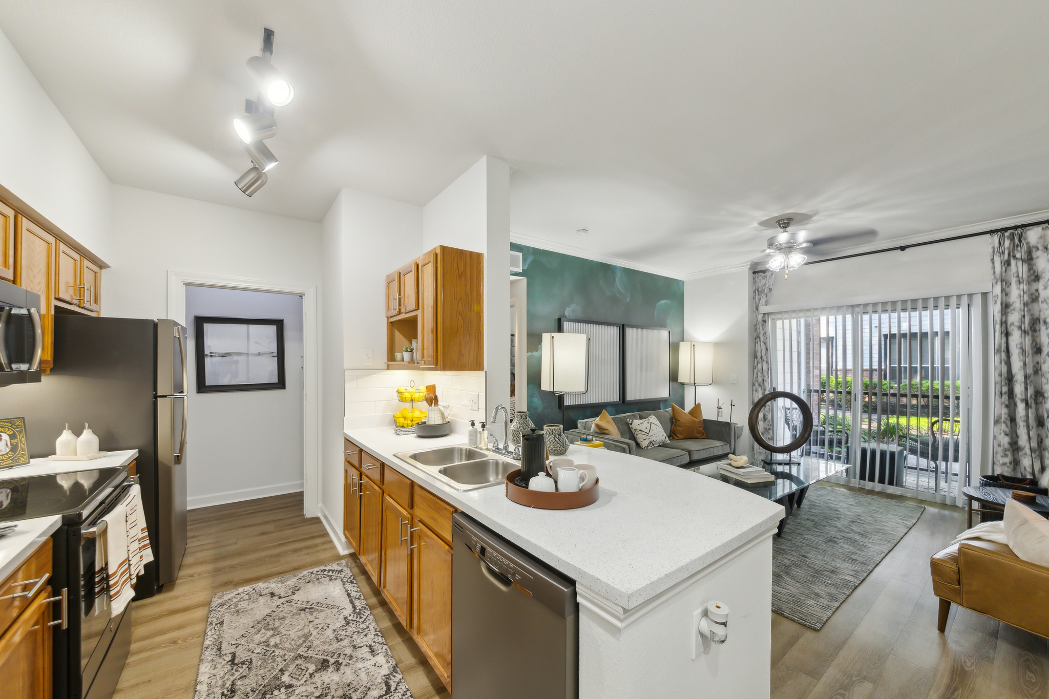the kitchen and living room area of a new apartment at The  Boulevard at Deer Park