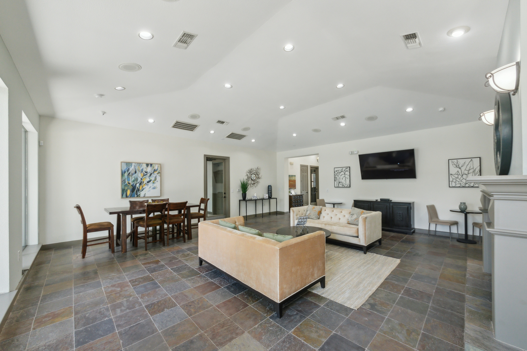 the living room has tile flooring and a large flat screen tv at The  Boulevard at Deer Park